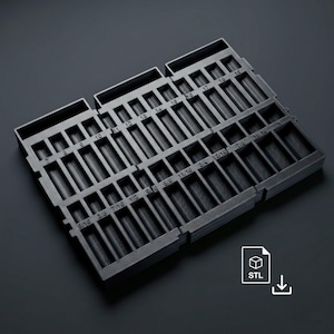 May include: A black, modular organiser tray with multiple compartments, each labelled with fractional inch measurements. The tray is designed to hold small parts or tools, with the STL file download icon visible in the corner.