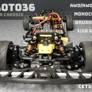 May include: A detailed image of a Proto36 RC car chassis. The chassis features a black front bumper, black tires, and gold and black suspension components. Text on the image includes "AWD/RWD/FWD", "Monocoque", "Brushless", and "1:10 Scale".