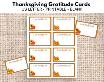 May include: Eight printable Thanksgiving gratitude cards with a brown background and a fall-themed design. Each card has the text "I am thankful for" and space for writing.