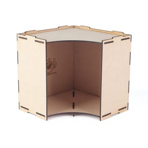 May include: A three-sided, unfinished wooden display shelf with a curved corner. The shelf is made of light brown wood and has a logo on the inside. The design features interlocking joints and is suitable for displaying small items.