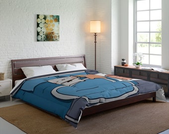 May include: A blue and brown duvet cover with a cartoon cat wearing a blue shirt and holding a cup of coffee. The cat is lying on its side and has a relaxed expression.