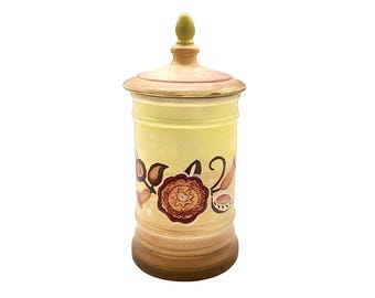 Bote de cerámica vintage con tapa, pintado a mano, estilo arte popular, color amarillo.