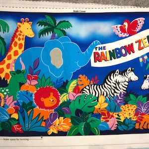May include: A colorful illustration of a book cover featuring a rainbow zebra, a giraffe, an elephant, and other animals. The text on the cover reads "The Rainbow Zebra".