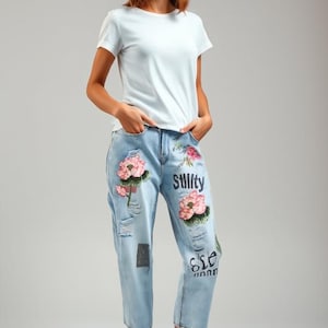 vintage women&#39;s jeans with flower embroidery