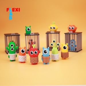 Puede incluir: Una colección de gomas de borrar con forma de monstruos coloridos. Las gomas son de varios colores, incluyendo verde, naranja, rojo, azul y amarillo. Algunas están en pequeñas jaulas. El texto "FLEXI LAB" está en la esquina superior izquierda.