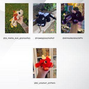 May include: A collection of handmade crochet dragons in various colors. One dragon is cream with red and yellow accents, another is black with white horns, and a third is purple with lavender wings. A fourth dragon is red with yellow and orange details.