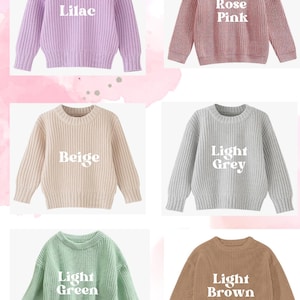 May include: Five different colored sweaters with white text on each. The sweaters are lilac, rose pink, beige, light grey, and light green. The text on the sweaters reads "Lilac", "Rose Pink", "Beige", "Light Grey", and "Light Green".