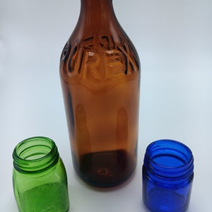 3 vintage bottles , vicks , purex , and green medicine jar