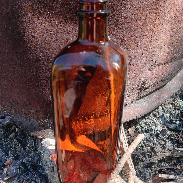 Very beautiful Vintage amber bottle .