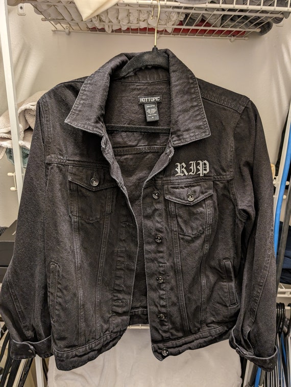 Black jean jacket with rips deals