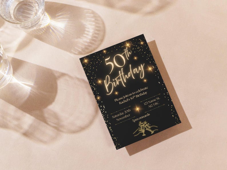 May include: A black 50th birthday invitation with gold text and accents. The invitation includes the text "50th Birthday", event details, and a champagne glass illustration. The invitation is on a light pink surface with shadows.