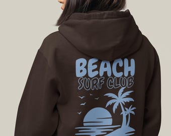 May include: A dark brown hooded sweatshirt featuring a light blue graphic on the back. The design displays the text BEACH SURF CLUB above a sunset, palm trees, and birds, with the text *Members Only* printed at the bottom of the graphic.