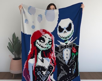 May include: A blue, white, and red knitted blanket featuring a pixelated image of Jack Skellington and Sally from the movie The Nightmare Before Christmas. The characters are standing together, with Jack in a black tuxedo and Sally in a black dress.