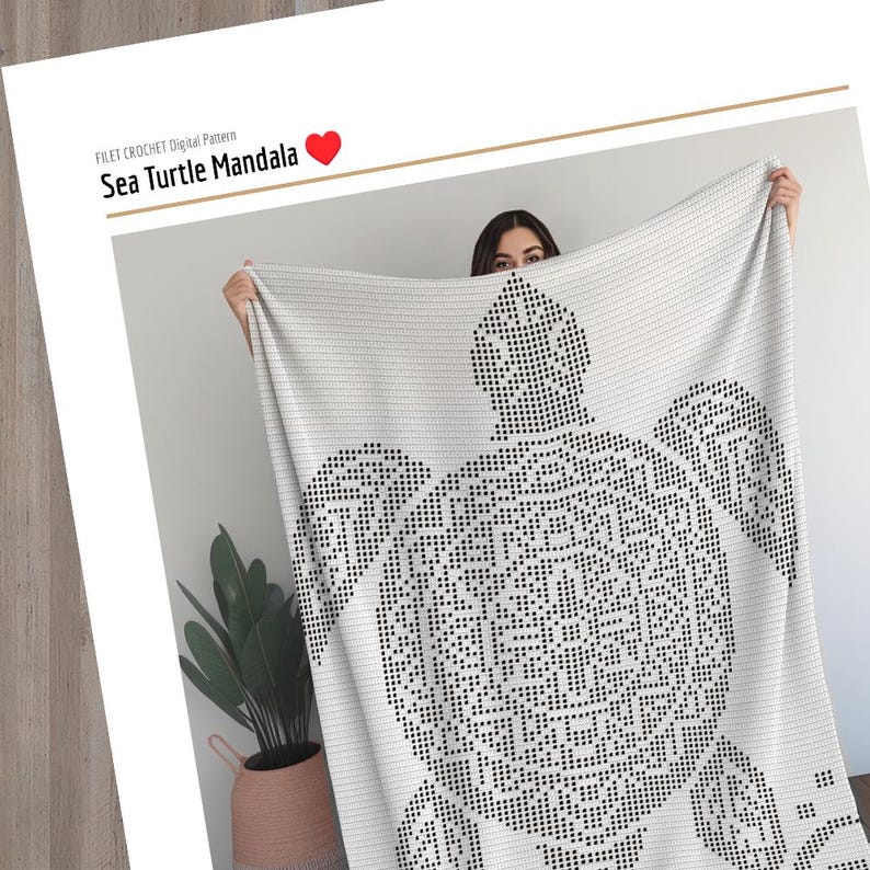 May include: A white blanket featuring a black sea turtle mandala design. The blanket is held up, displaying the intricate pattern. Text at the top reads "FILET CROCHET Digital Pattern" and "Sea Turtle Mandala".