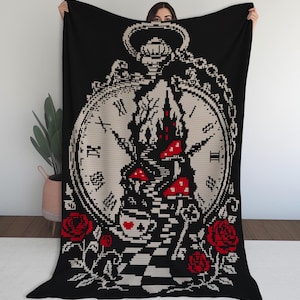 May include: A black throw blanket featuring a large, beige pocket watch graphic with Roman numerals. The design includes a central staircase leading to a castle, red mushrooms, a teacup with a heart, a key, and red roses at the bottom corners.