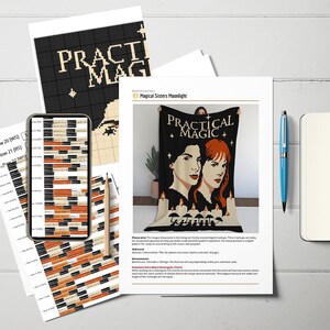 May include: A black and cream-colored blanket with the words "PRACTICAL MAGIC" and images of two women and candles. The image is on a white sheet of paper with other papers, a phone, a pen, and a notebook.