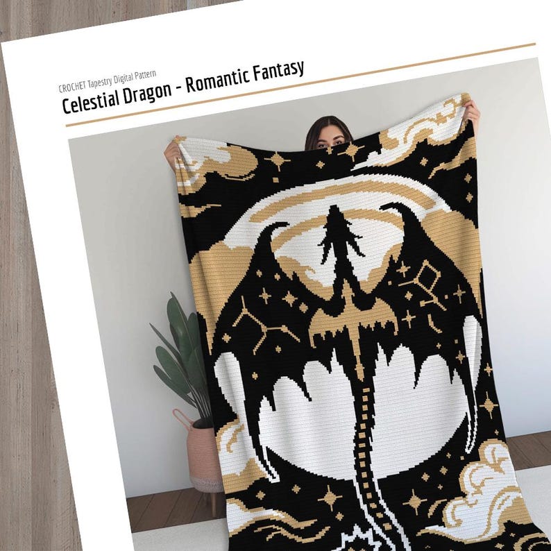 May include: A black, white, and gold crochet tapestry blanket featuring a celestial dragon design. The blanket has a large dragon silhouette with outstretched wings, stars, and a moon. The text "Celestial Dragon - Romantic Fantasy" is visible.