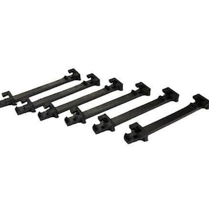 May include: Six black plastic cable ties with a locking mechanism. The ties are arranged in a row, with the locking mechanism facing the viewer.