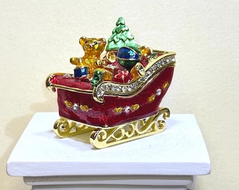 Festive Santa sleigh trinket box with teddy bear, gifts & Christmas tree. Hand-painted enamel, sparkling details—perfect holiday décor gift!