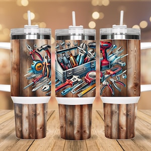 May include: Three stainless steel tumblers with lids and handles. Each tumbler features a different design of tools and a toolbox on a woodgrain background.