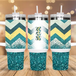 May include: Three stainless steel tumblers with a teal glitter bottom and a white band. The tumblers have a chevron pattern in yellow, white, and teal. One tumbler has the word "MOM" in yellow and teal on the front.