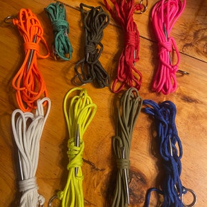 May include: Assortment of colorful paracord with metal needles and rings. The paracord is in various colors, including orange, green, yellow, red, pink, white, blue, and brown.