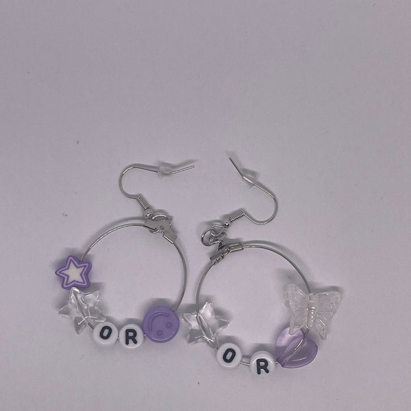 or earrings  g. u. t. s.  tour earrings