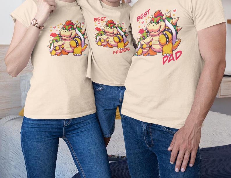May include: Three beige t-shirts with a cartoon image of a green, yellow, and red character with a crown. The text on the shirts reads "Best Friends" and "Best Dad".