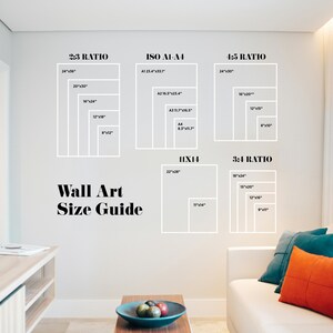 May include: A white wall with a guide for wall art sizes. The guide shows different aspect ratios and corresponding sizes in inches. The text "Wall Art Size Guide" is written in black at the bottom of the guide.