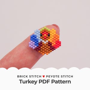 May include: A beaded turkey craft pattern using brick stitch and peyote stitch. The pattern is for a small turkey with a brown body, orange and yellow feathers, and a blue and purple tail.
