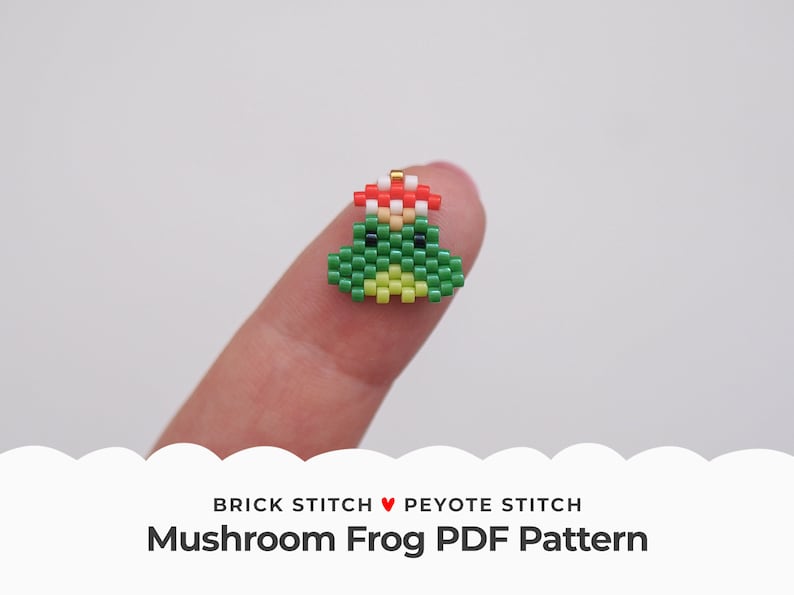May include: A green and yellow beaded frog wearing a red and white mushroom hat. The frog is made with brick stitch and peyote stitch beading techniques. The text "BRICK STITCH &hearts; PEYOTE STITCH Mushroom Frog PDF Pattern" is below the frog.
