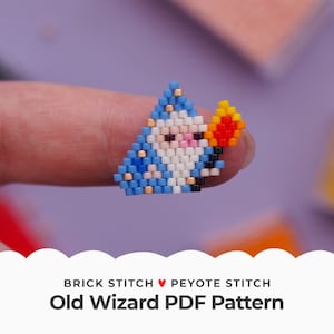 May include: A beaded pattern for a wizard with a blue robe, white beard, and orange flames. The pattern is made with brick stitch and peyote stitch. The text "Old Wizard PDF Pattern" is below the image.