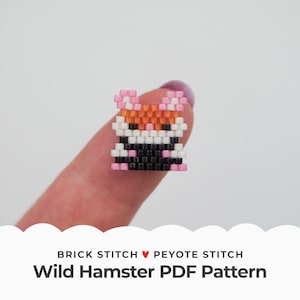 May include: A small, colorful bead sprite of a hamster, made with black, white, orange, and pink beads. The bead sprite is being held by a finger, and the text "BRICK STITCH ♥ PEYOTE STITCH Wild Hamster PDF Pattern" is below the image.