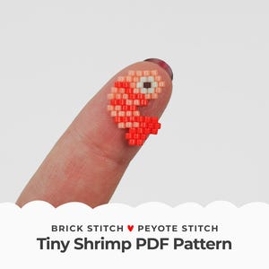 May include: A tiny red and orange beaded shrimp, made with brick stitch and peyote stitch, is held on a finger. The image includes the text "BRICK STITCH ♥ PEYOTE STITCH Tiny Shrimp PDF Pattern".