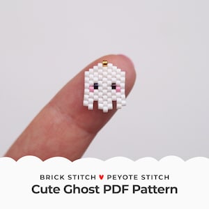 May include: A white beaded ghost with pink cheeks and black eyes. The ghost is made with brick stitch and peyote stitch and is a PDF pattern.