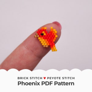 May include: A small beaded phoenix bird in red, orange, and yellow colors. The bird is being held by a finger. The image includes the text "Brick Stitch ♥ Peyote Stitch Phoenix PDF Pattern".