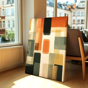 Large Canvas depicting a mid-century modern abstract Artwork is leaning on a wall. Geometrical warm colors. Bauhaus inspired painting.
