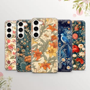 May include: Five different phone cases with floral and bird designs. The cases are all clear and show the phone's camera lens. The designs include a blue bird on a floral background, a floral pattern with orange and yellow flowers, a floral pattern with red and white flowers, a floral pattern with blue and white flowers, and a floral pattern with green and white flowers.