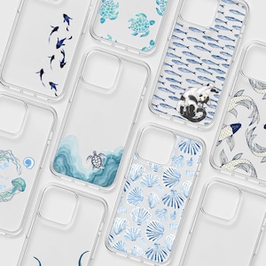 May include: A collection of clear phone cases featuring various aquatic designs including dark blue koi fish, teal sea turtles, a cat surrounded by small blue fish, a sea turtle swimming in blue waves, blue seashells, and jellyfish with a shell.