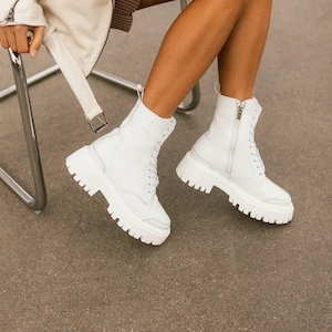 Handmade white boots with fleece or sheepskin lining