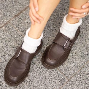 Elegant women’s brown leather flat shoes with small heel