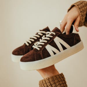 Suede sneakers with decorative leather inserts. Sneakers in natural leather, casual shoes for the city