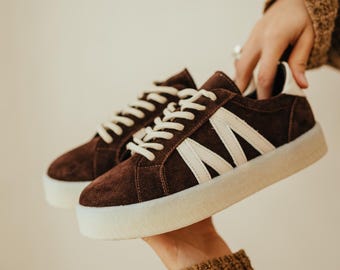 Suede sneakers with decorative leather inserts. Sneakers in natural leather, casual shoes for the city