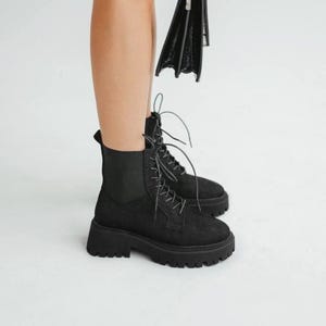 Black nubuck boots with elastic fabric insert and durable sole