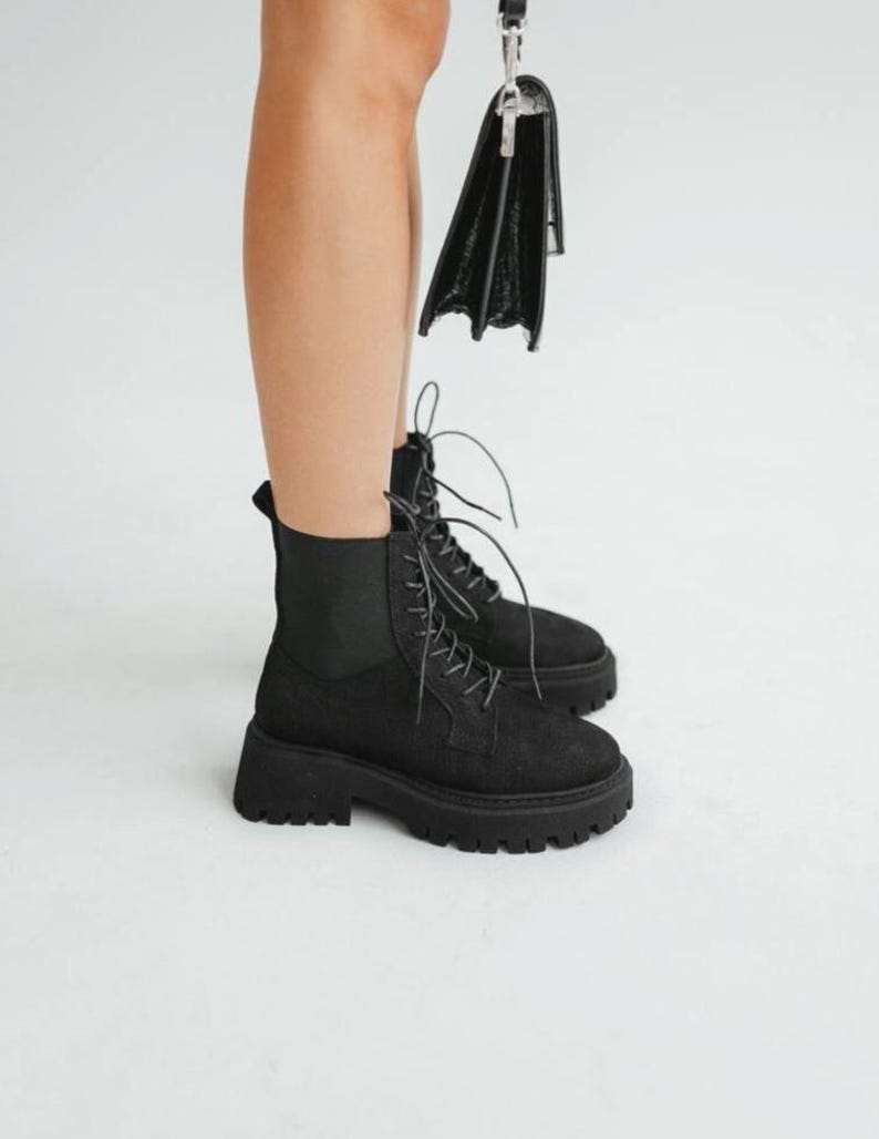Black nubuck boots with elastic fabric insert and durable sole