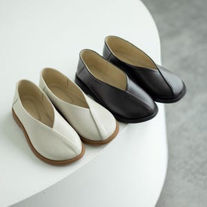 Black genuine leather summer shoes with comfortable fit.