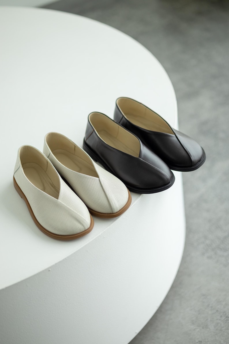 Black genuine leather summer shoes with comfortable fit.