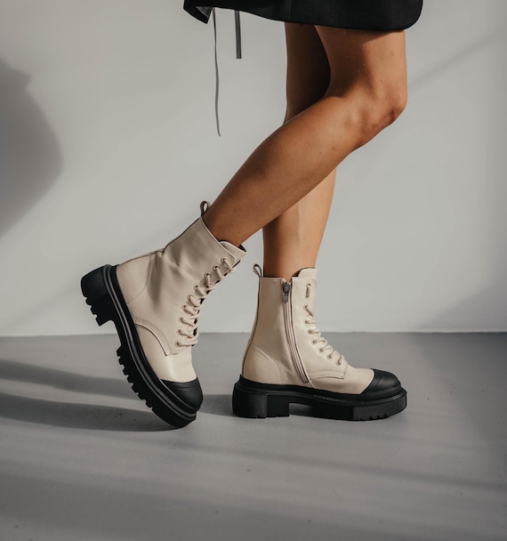 Milk leather boots with black toe detail, side zipper, two lining options fleece or sheepskin, handmade footwear