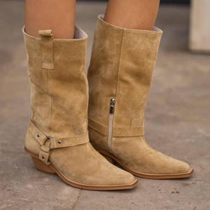 Beige suede cowboy boots with side zipper and mid-calf design