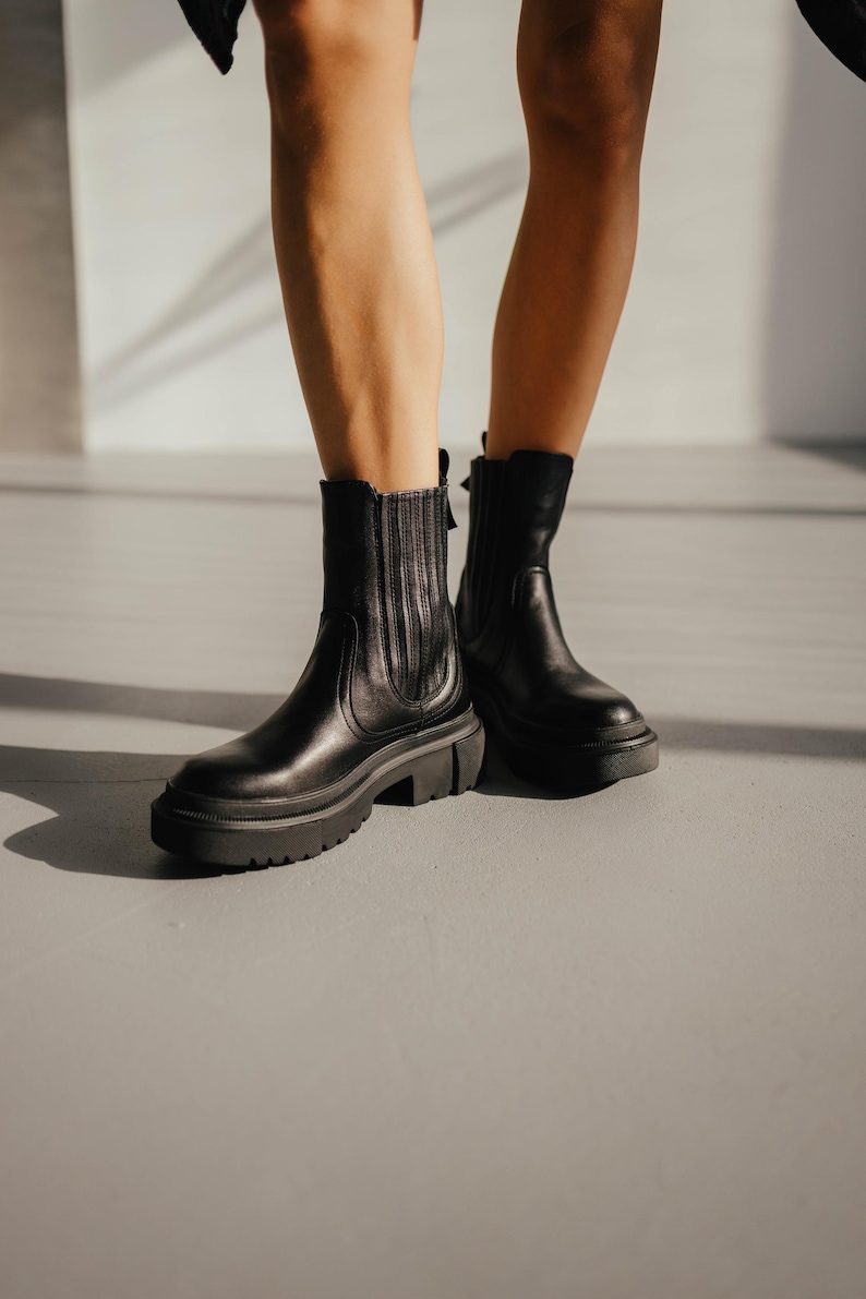 Black leather chelsea boots with chunky sole and fleece lining